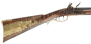 Golden Age Longrifle,
.45 caliber,  42" Colerain swamped barrel, 
curly maple, engraved brass patchbox, 
double set triggers, large Siler lock, unsigned, 
